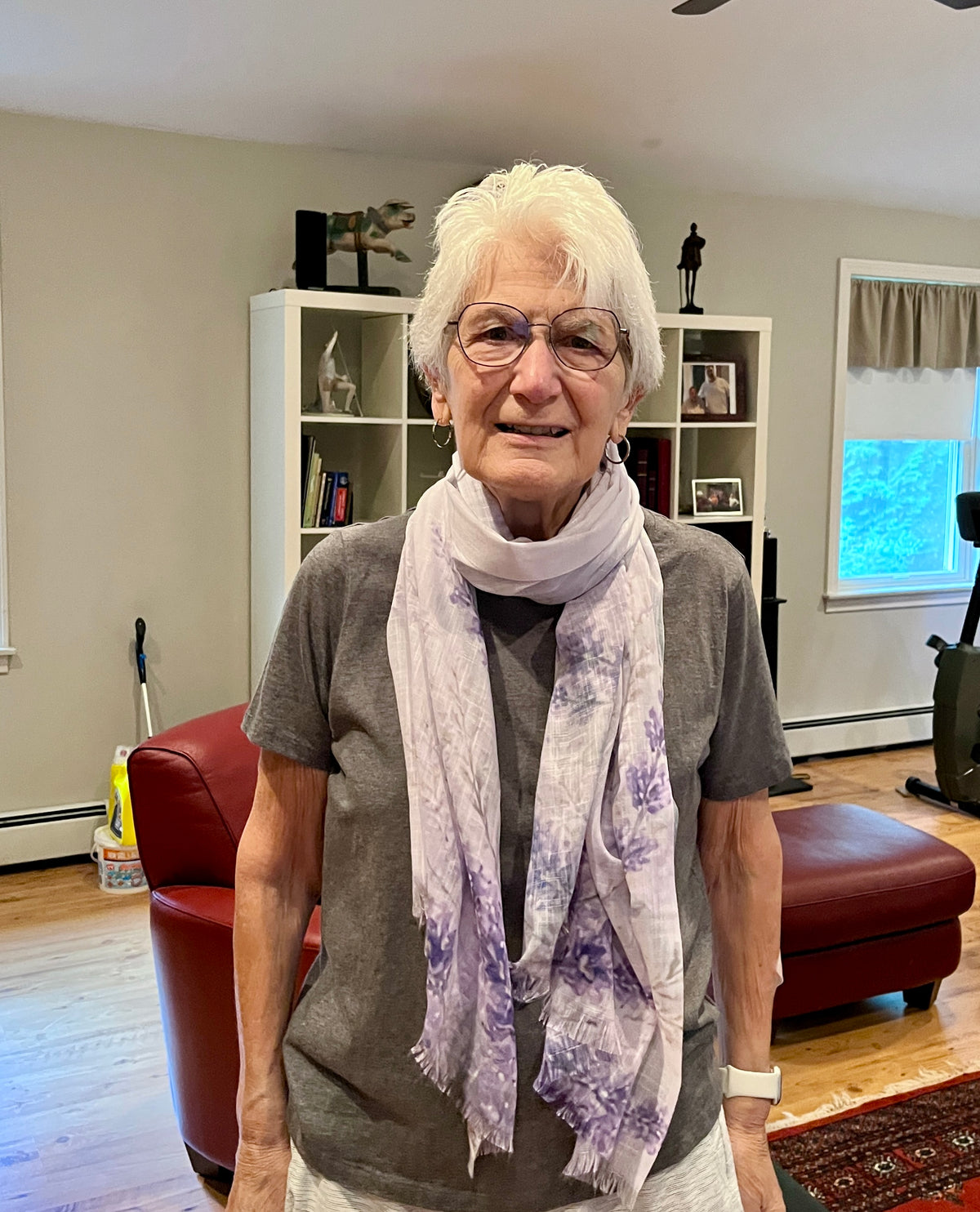 Customer wearing Sarah’s Song light scarf as a shoulder wrap